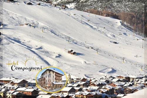 a small town in the snow next to a ski slope at Hotel Compagnoni in Livigno