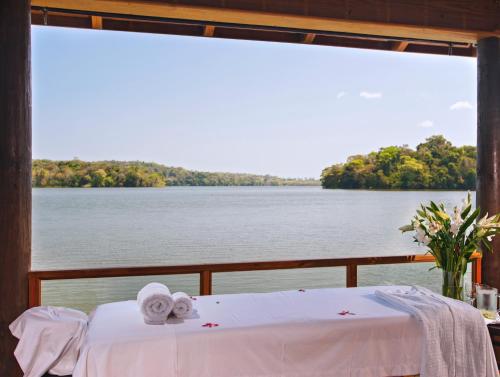 a table with towels and a view of the water at Las Lagunas Boutique Hotel in Flores