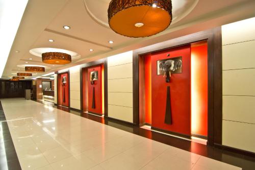 a hallway with red doors in a building at Golden Sea Pattaya - SHA Extra Plus in Pattaya Central