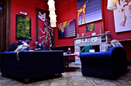 
a living room filled with furniture and a fire place at Art Factory San Telmo in Buenos Aires
