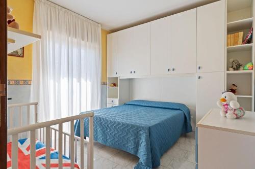 a small bedroom with a bed and a staircase at Appartamento Sicilia Etna e Mare in Mascali
