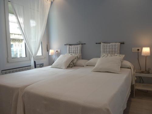 Кровать или кровати в номере Pensión Gárate