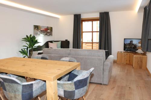 a living room with a couch and a table at Appartamenti Forhotel in Livigno
