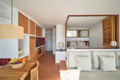 a bedroom with a bed with a large mirror at Beachfront SUITE in CADAQUES center in Cadaqués