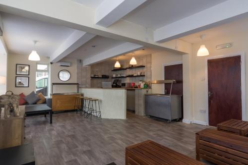 a living room with a kitchen and a living room at The Waves Hotels in Skegness