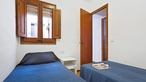 מיטה או מיטות בחדר ב-Apartment Bone 2 - Llafranc