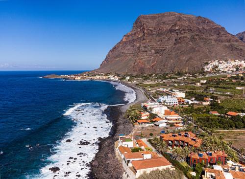 an aerial view of a beach with a mountain at Apartamentos Punta Marina in Valle Gran Rey