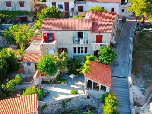 an overhead view of a house with red roofs at Apartments Račić in Bol