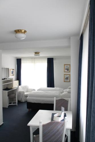 Postel nebo postele na pokoji v ubytování Hotel Windthorst