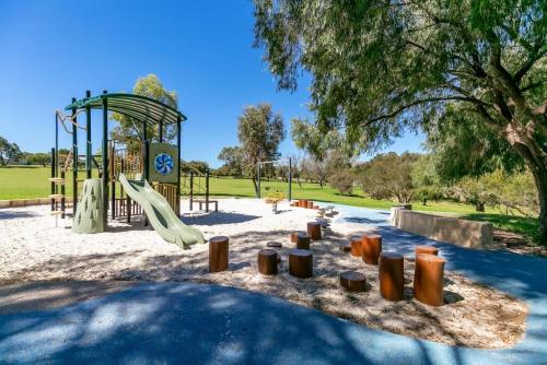 a playground with a slide in a park at A3 Modern Apt with Free Parking and Private Bathroom in Perth