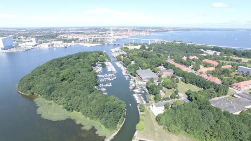 an island in the water with a bunch of boats at Hotel Dänholm in Stralsund