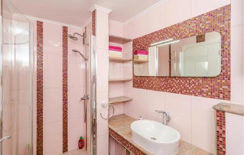 a bathroom with a sink and a shower at Nice Apartment In Dubrovnik With 2 Bedrooms And Wifi in Dubrovnik