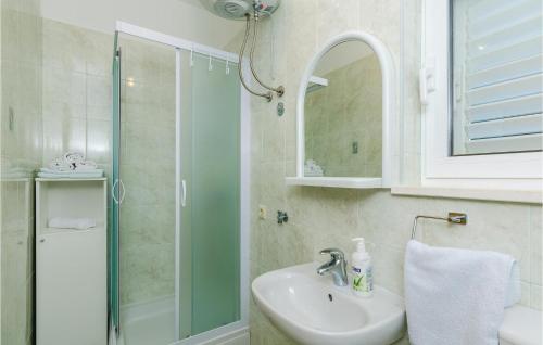 a bathroom with a sink and a shower at Beautiful Apartment In Gruda With Kitchen in Molunat