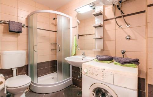 a bathroom with a toilet a sink and a shower at 2 Bedroom Beautiful Home In Vodnjan in Vodnjan