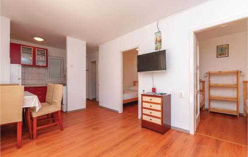 a living room with a kitchen and a dining room at Two-Bedroom Apartment In Jadrija in Jadrija