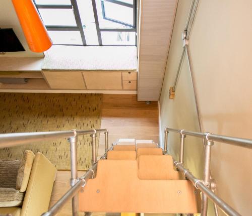 a staircase in a room with a window at Claron Lodge in West Wittering