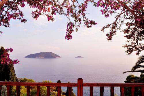 a view of the ocean from a red bench at Nemesis in Neo Klima