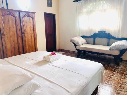 Ένα ή περισσότερα κρεβάτια σε δωμάτιο στο Gihan villa