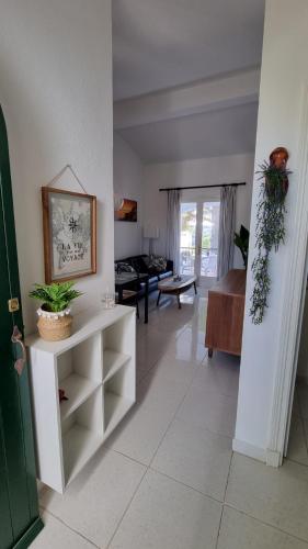 a living room with a couch and a table at HOLIDAYS MENORCA Cala Galdana in Cala Galdana