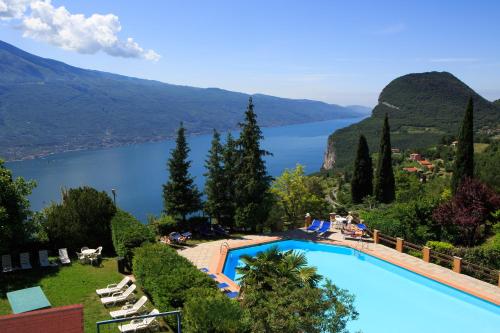 a swimming pool with a view of a lake at Hotel Panorama e Residence in Tremosine Sul Garda