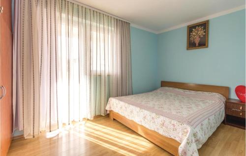 A bed or beds in a room at Nice Apartment In Liznjan With 1 Bedrooms And Wifi