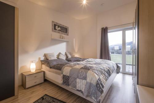 Postel nebo postele na pokoji v ubytování Appartement Raffael