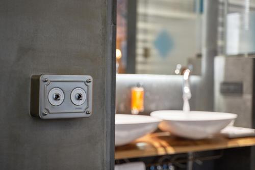 a bathroom with two white sinks on a counter at Hotel The Public - Special Category in Istanbul