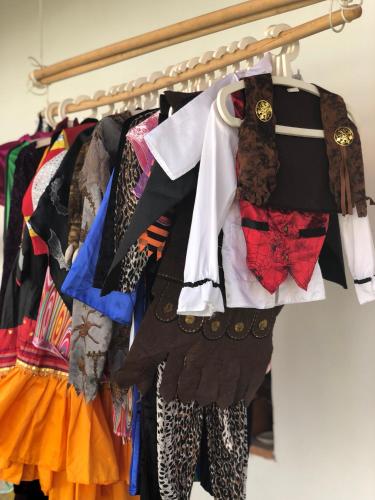 a bunch of clothes hanging on a rack at Penzion a hospoda Na statku in Hluboká nad Vltavou