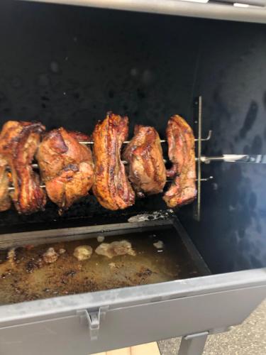 a group of meat being grilled in an oven at Penzion a hospoda Na statku in Hluboká nad Vltavou