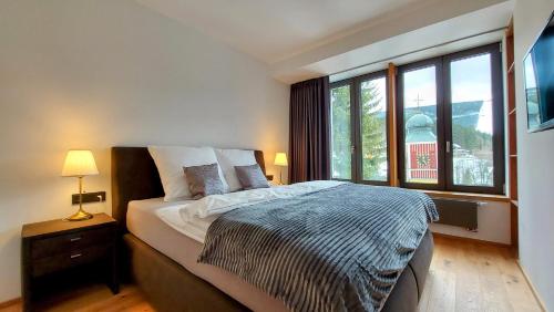 Postel nebo postele na pokoji v ubytování Apartments with mountain views