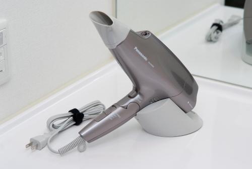a hair dryer sitting on a counter top at Dormy Inn Hakata Gion in Fukuoka