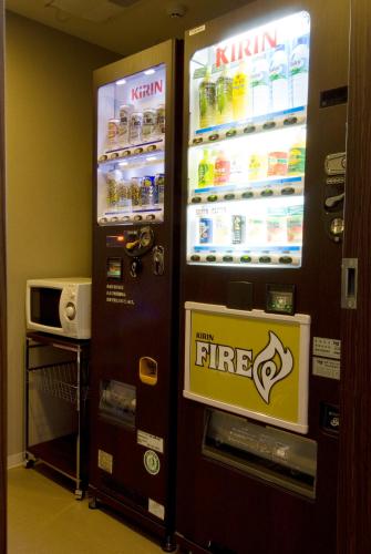 a large refrigerator with a free sign in front of it at Dormy Inn Hakata Gion in Fukuoka