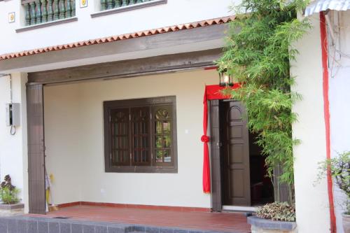 a building with a gate and a door at Vista Rio - Scenic River View, Walk to Jonker St in Melaka