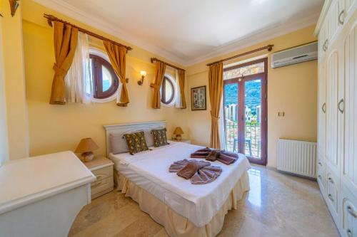 A bed or beds in a room at VILLA AYCHiN