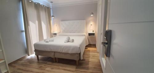 Katil atau katil-katil dalam bilik di Hostal La Ermita