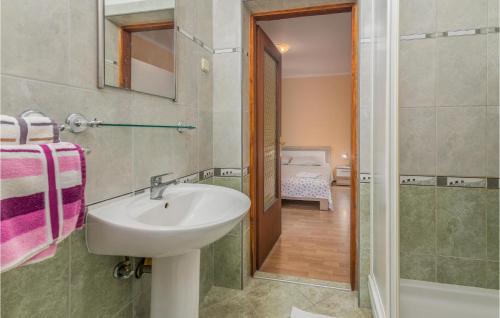 a bathroom with a sink and a walk in shower at 1 Bedroom Amazing Apartment In Mali Losinj in Mali Lošinj