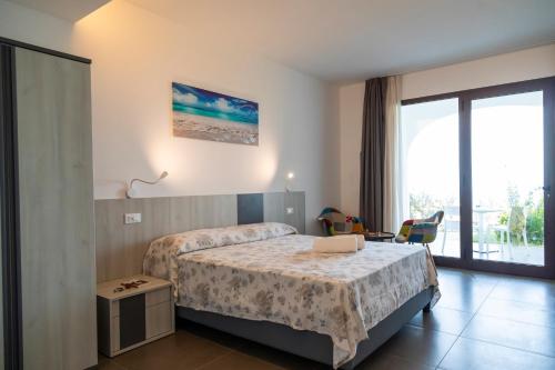 Ένα ή περισσότερα κρεβάτια σε δωμάτιο στο LUZIA AGRIRESORT Amazing Nature Atmosphere