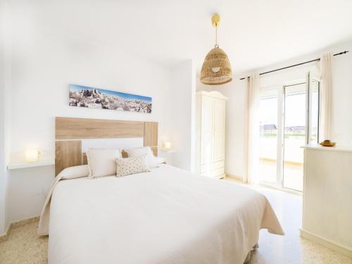 A bed or beds in a room at Cubo's La Terraza del Mar