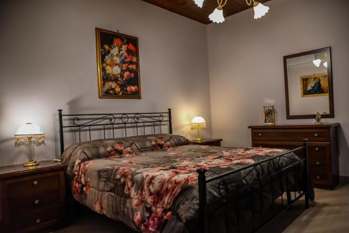 Säng eller sängar i ett rum på Etna Dimora dei Saponari
