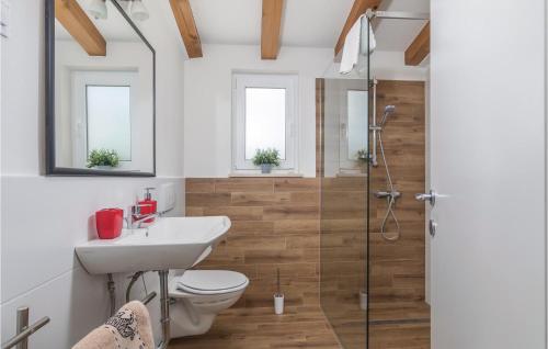 a bathroom with a shower and a toilet and a sink at Beautiful Home In Bale With Kitchen in Bale
