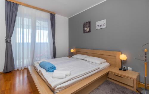 a bedroom with a bed and a large window at Pet Friendly Apartment In Selce With House Sea View in Selce