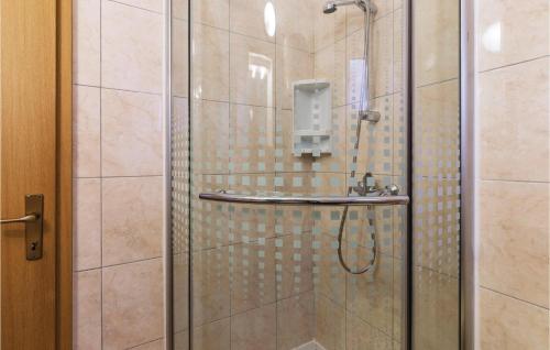 a shower with a glass door in a bathroom at 1 Bedroom Gorgeous Apartment In Banjole in Banjole