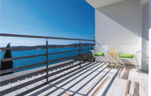 a balcony with a view of the water at Two-Bedroom Apartment In Brodarica in Brodarica