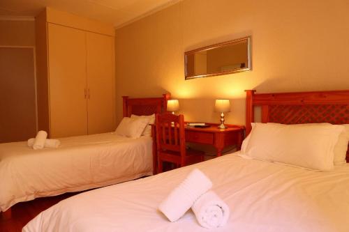 Ένα ή περισσότερα κρεβάτια σε δωμάτιο στο Georeen Guest House