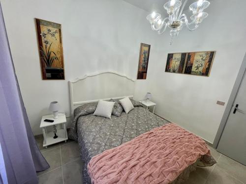 מיטה או מיטות בחדר ב-Affittacamere Il Piccolo Borgo Foligno