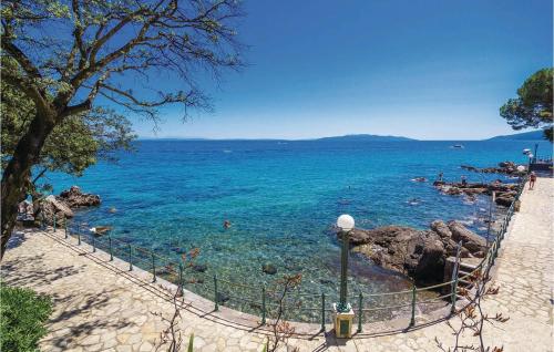 a view of the ocean from a beach at Nice Apartment In Volosko With Kitchen in Volosko