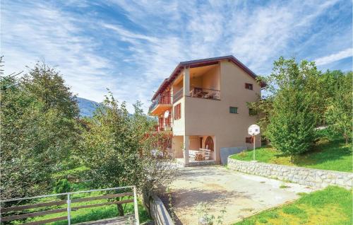 a house on a hill with a stop sign at 7 Bedroom Pet Friendly Home In Crni Kal in Crni Kal