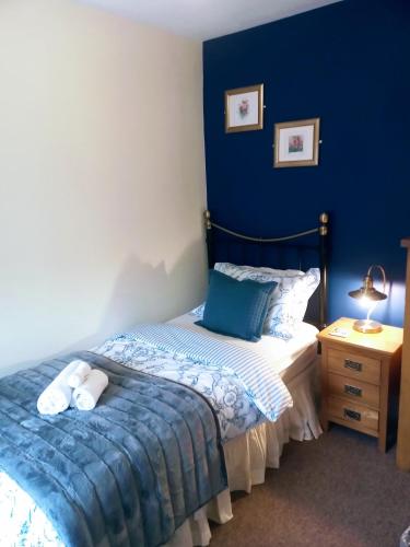 Ένα ή περισσότερα κρεβάτια σε δωμάτιο στο Oakfield Guest House