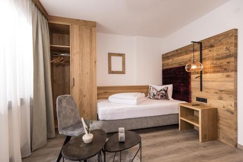 Una cama o camas en una habitación de Pension Rofan