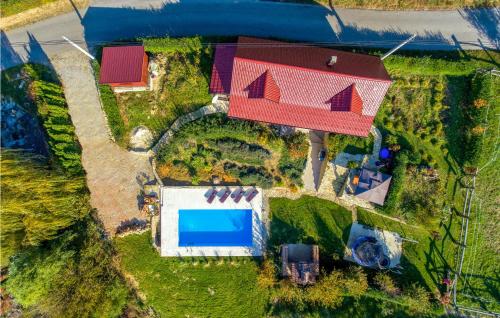 an aerial view of a house with a swimming pool at Beautiful Home In Seketin With Sauna in Seketin